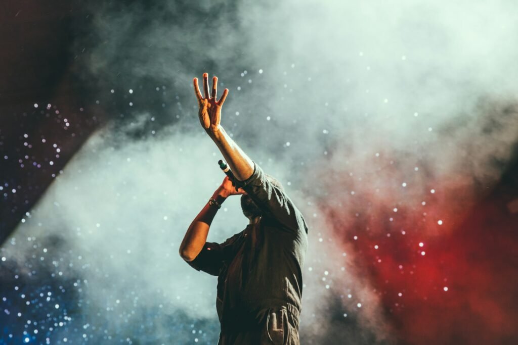 Singer performing live on stage with a microphone